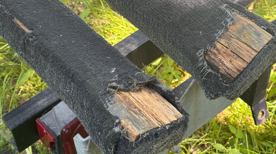Worn pontoon trailer bunk carpet ready for replacement
